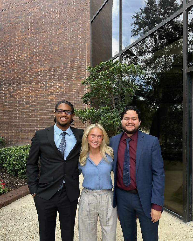 Three Social Standard team members together outside the office