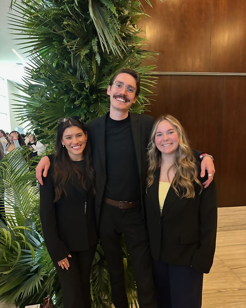 Three Social Standard colleagues together at a team event