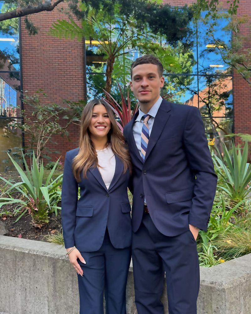 Two Social Standard representatives in business dress outside an office building
